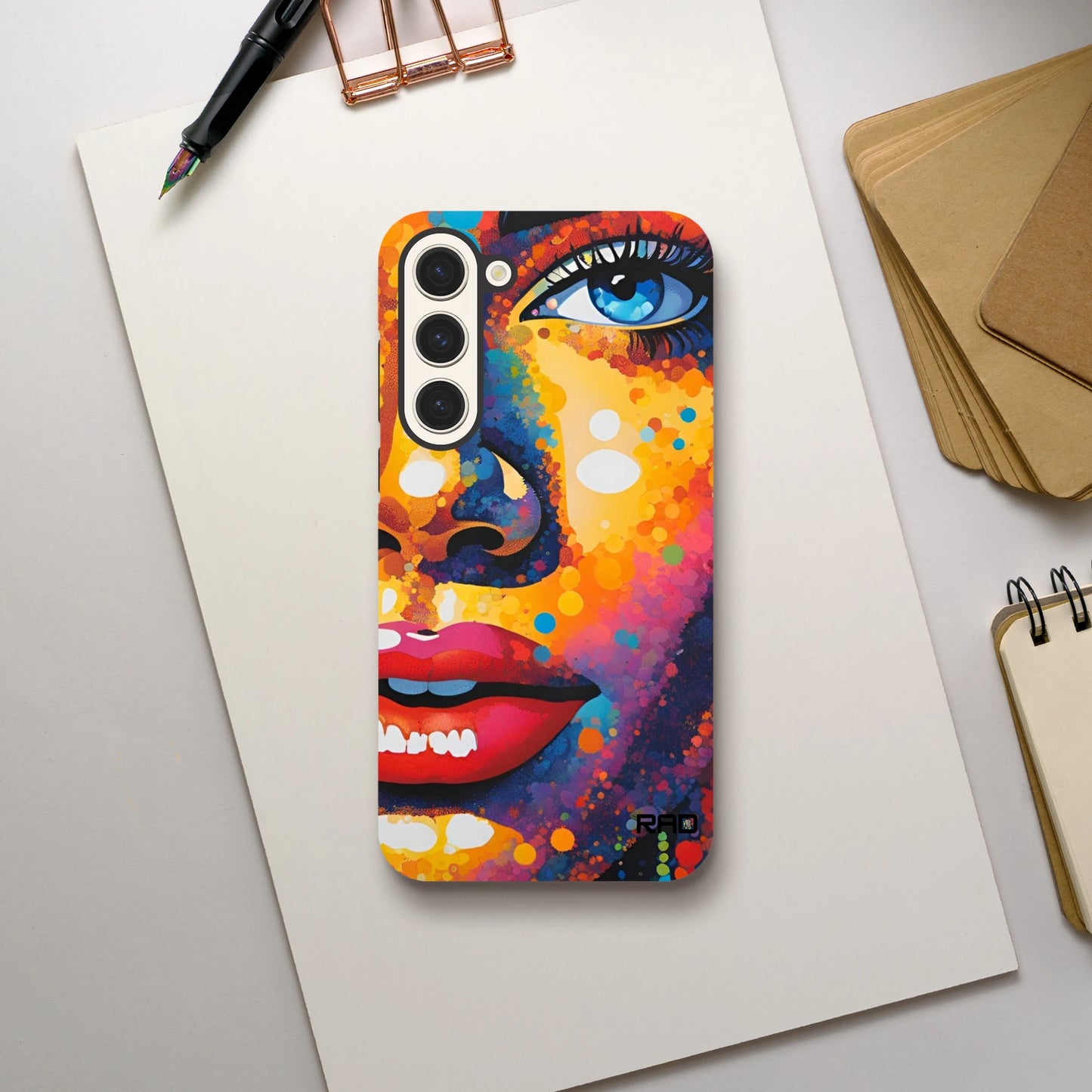 Colorful phone case with artistic design on a white surface