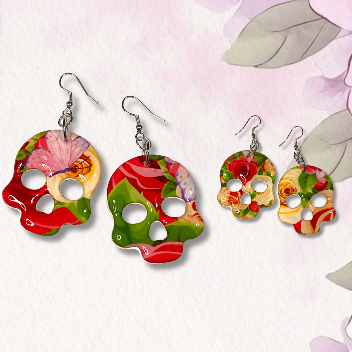 Colorful skull-shaped earrings on a light background