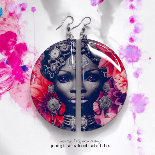 Earrings with a colorful design of a woman's face on a floral background, labeled 'pourgirlarts handmade tales'.