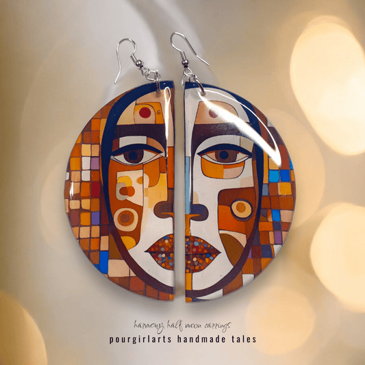 Colorful abstract face earrings on a soft background with 'pourgirlarts' branding.