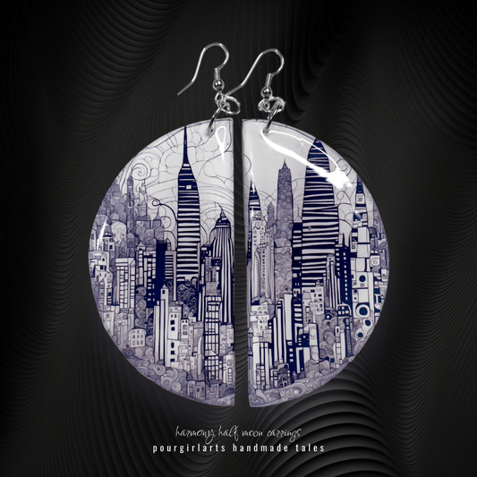 Earrings with cityscape design on a dark background