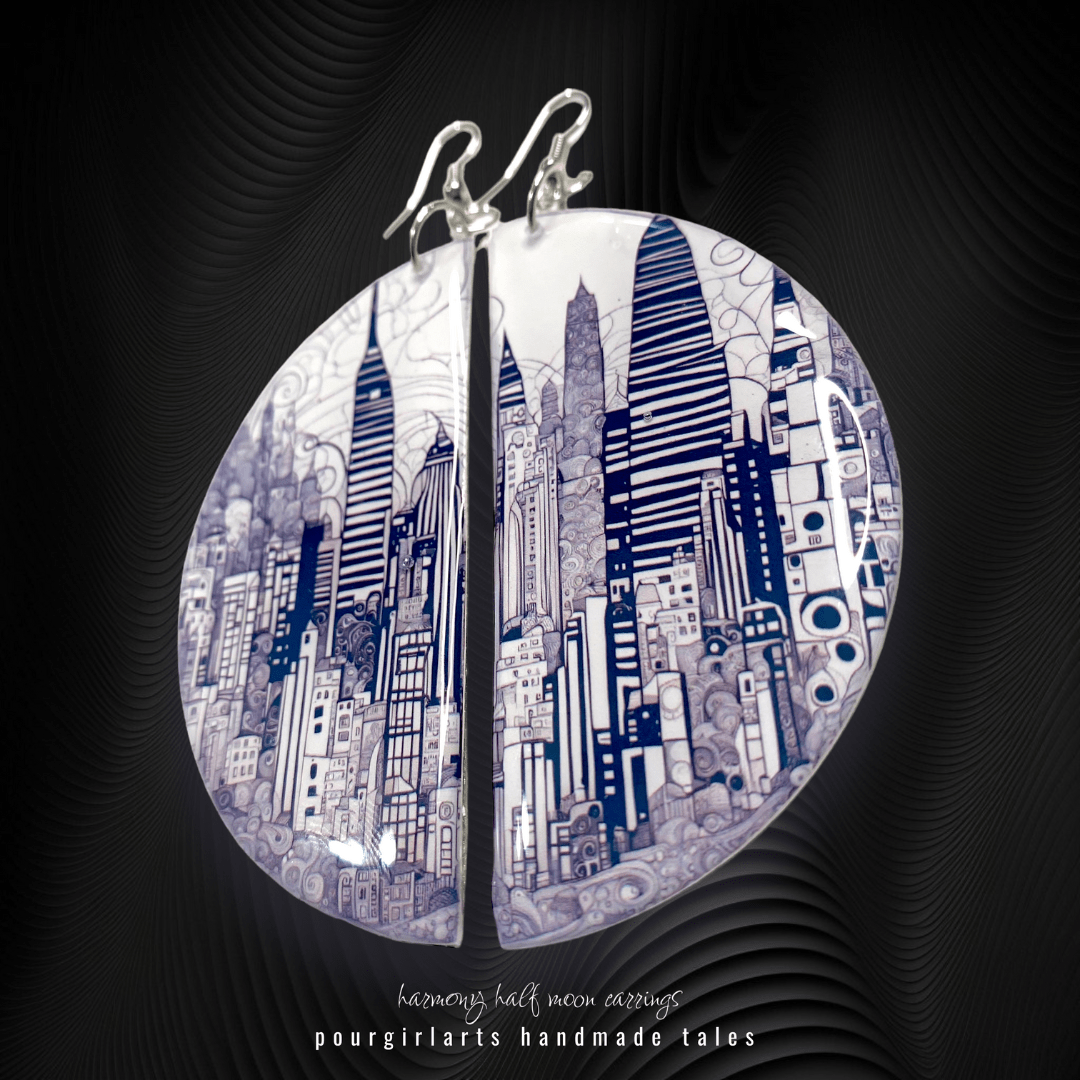 Cityscape earrings on a dark background with 'pourgirlarts' branding.
