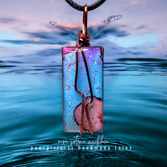 Colorful pendant necklace with a blurred water background