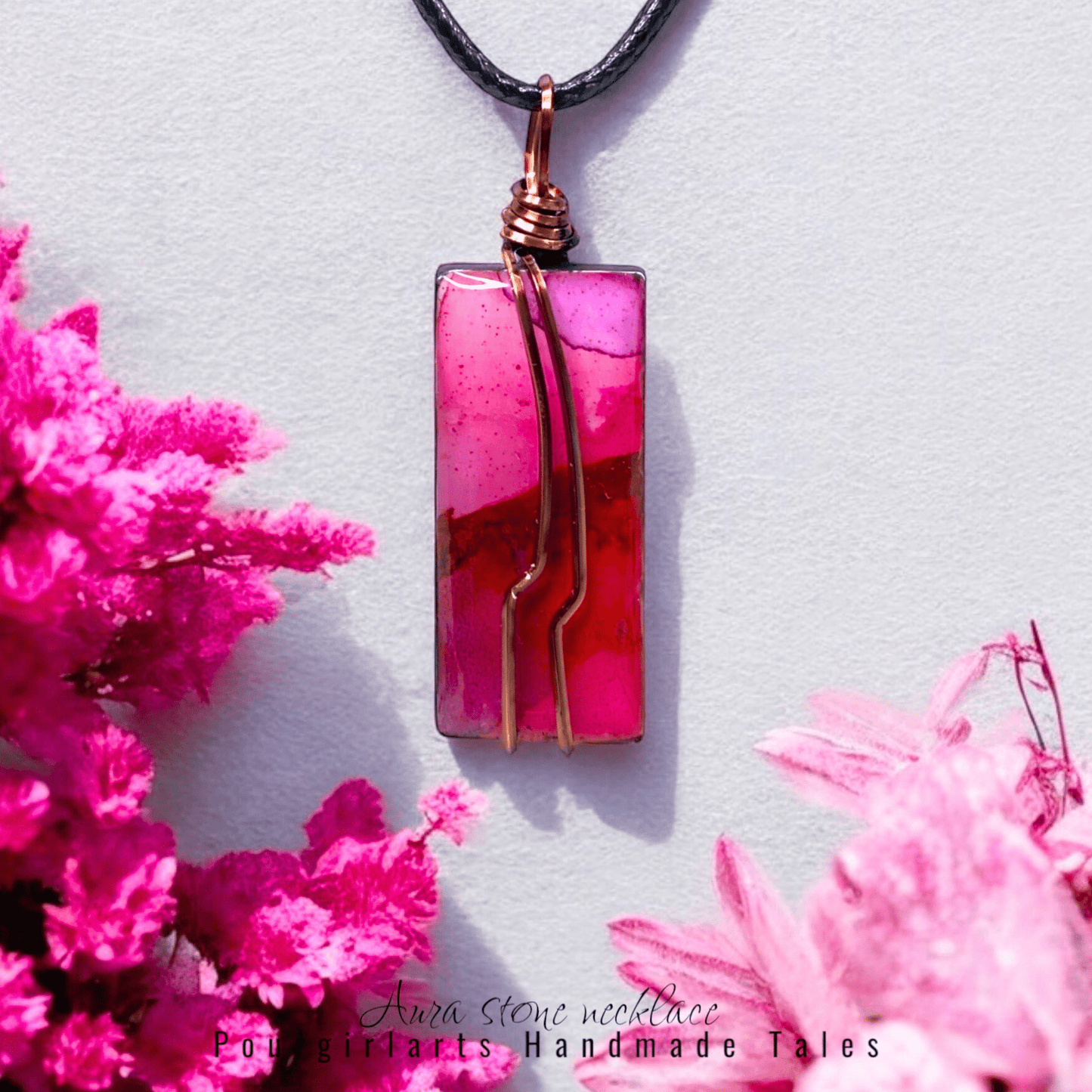 Pink pendant necklace with a floral background