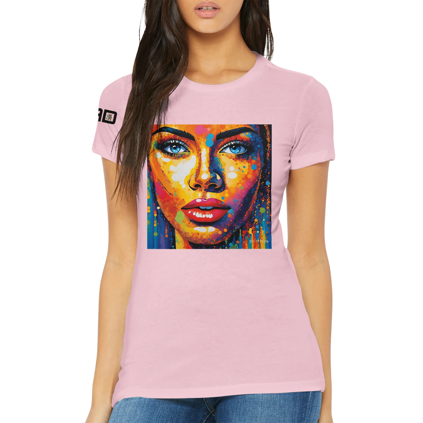 Person wearing a pink t-shirt with a colorful graphic of a face on a white background