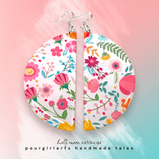 Floral half-moon earrings on a colorful background with 'pourgirlarts handmade tales' text.